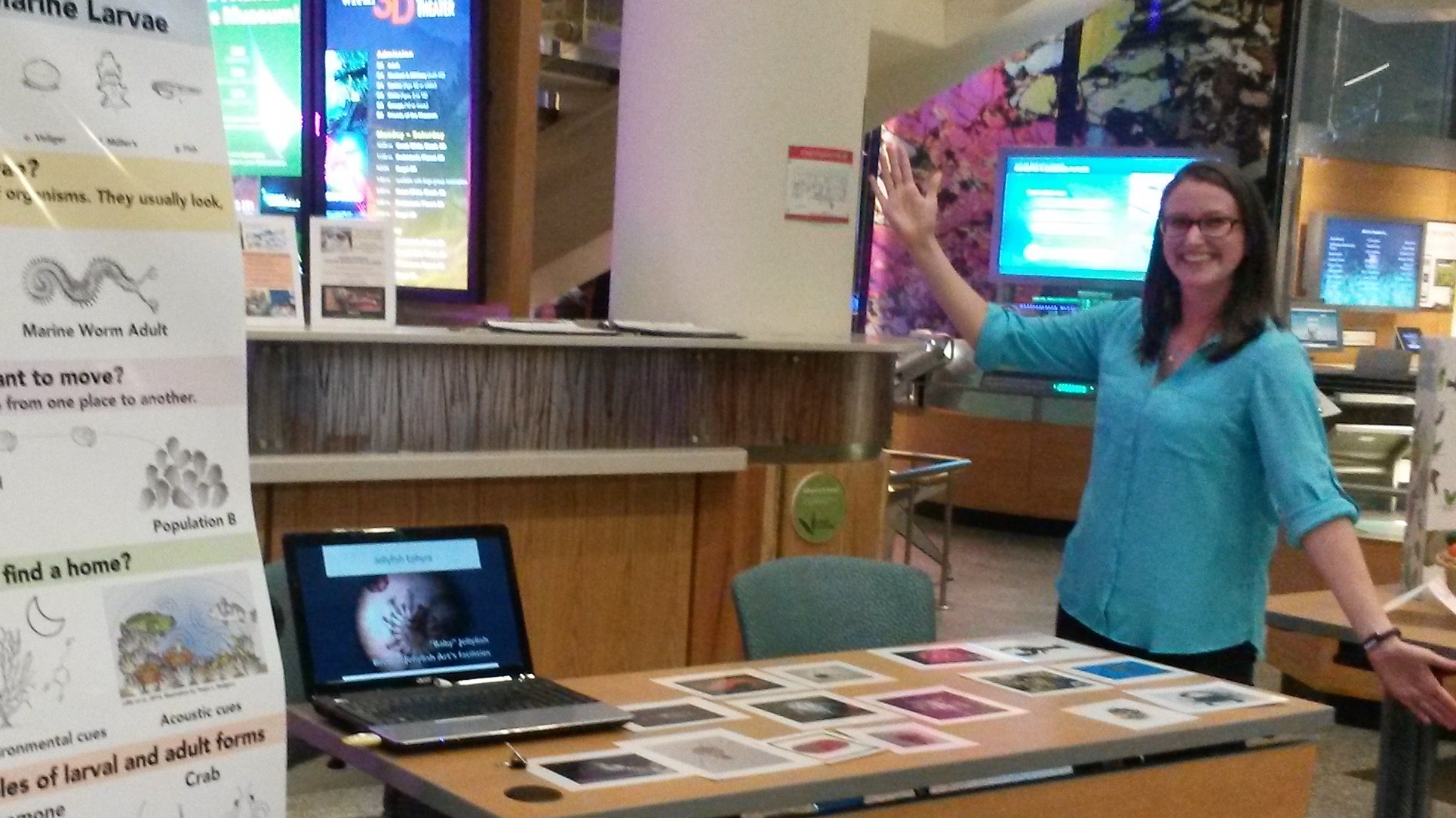 Woman standing by display