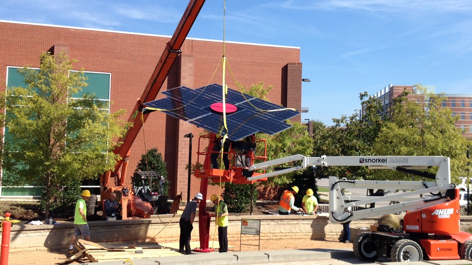 Equipment lowers panel into place