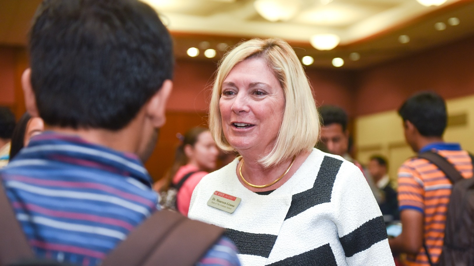 Maureen Grasso talks with student at orientation