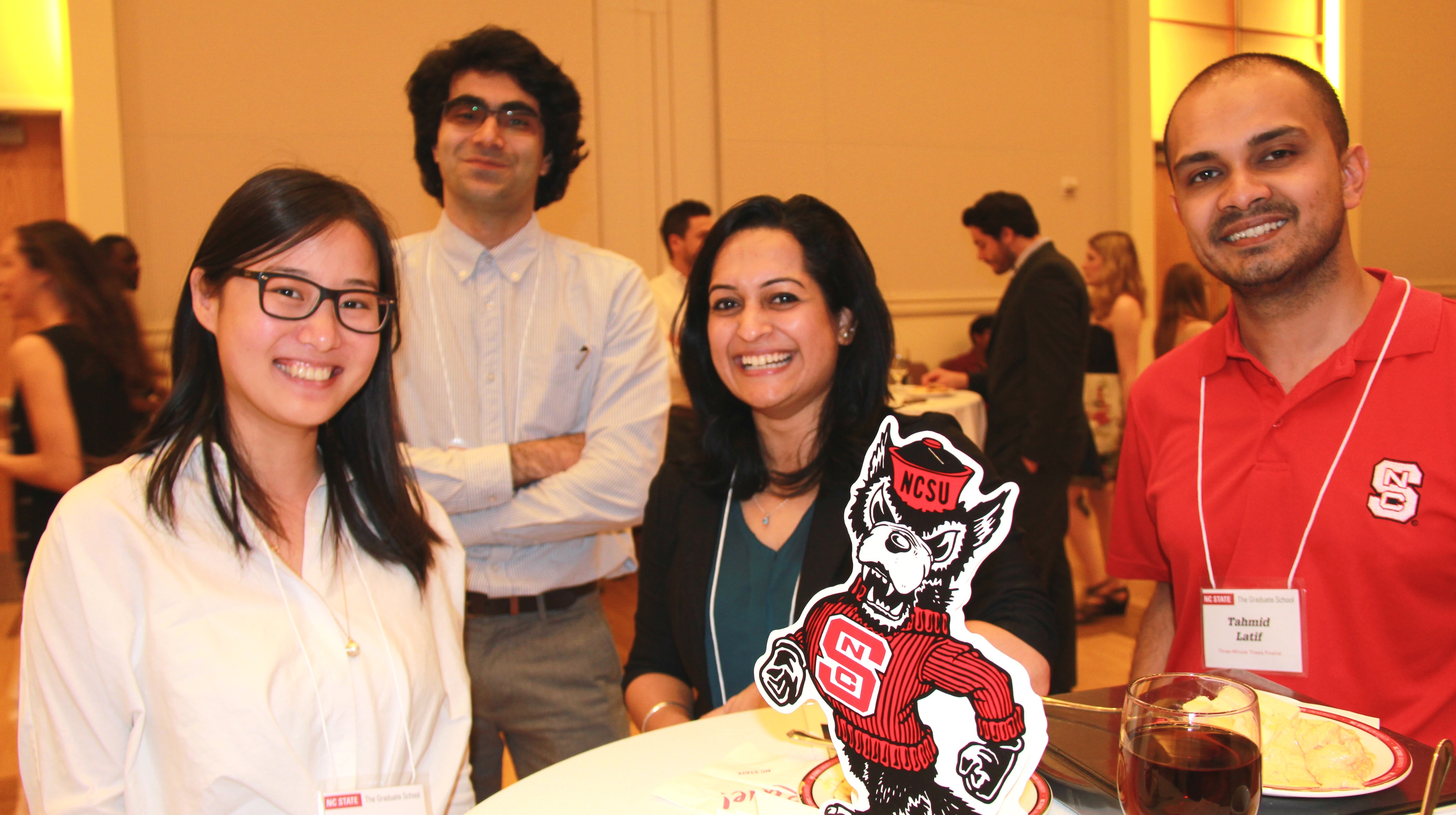 four students at table