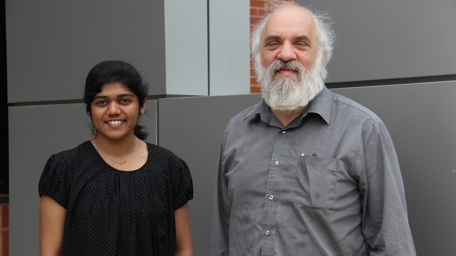 Sindhu and David in front of Grad School