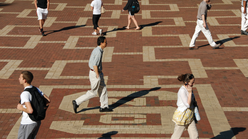 people walking on brickyard