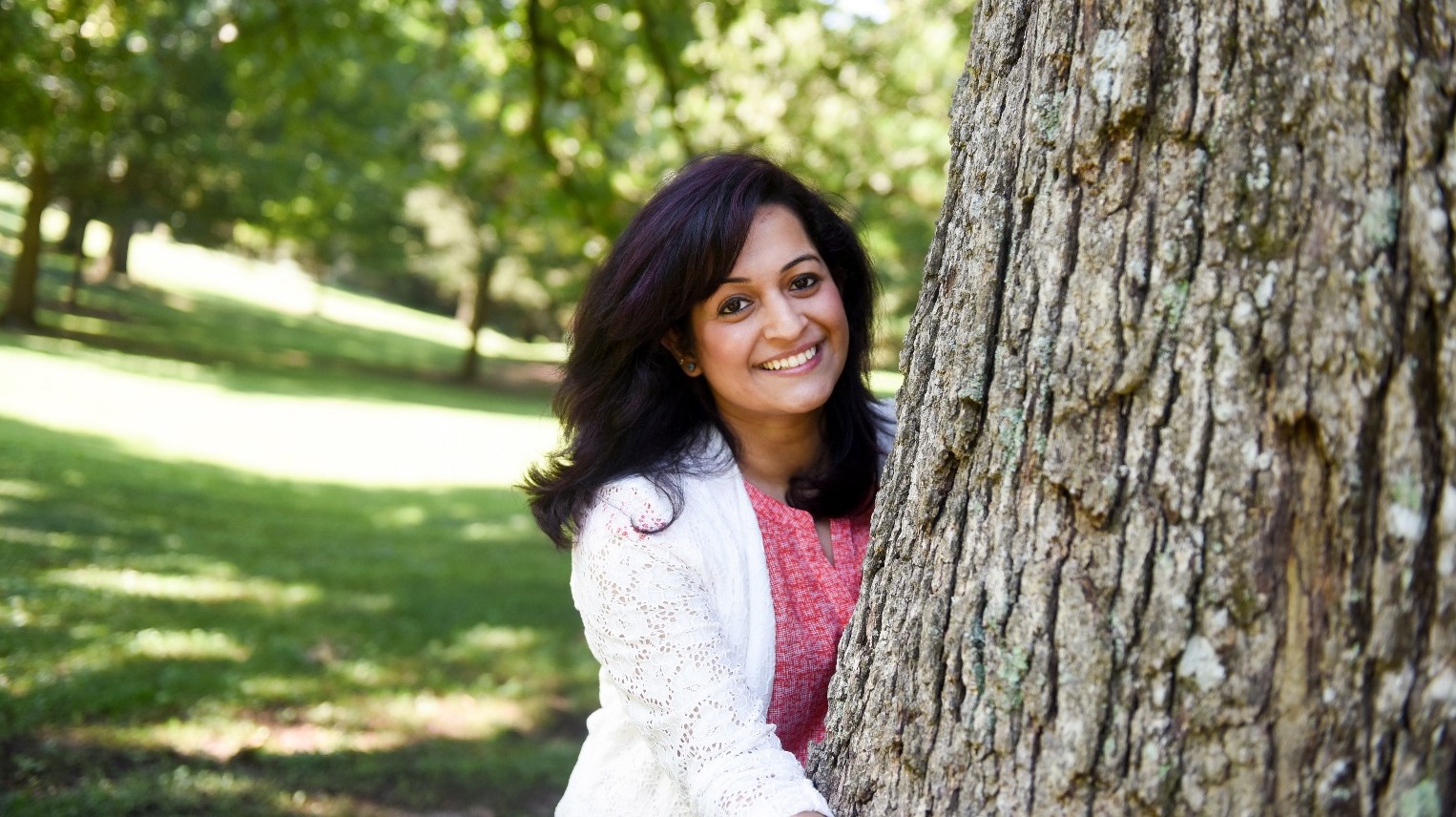 Sonika Rawal with arms around tree
