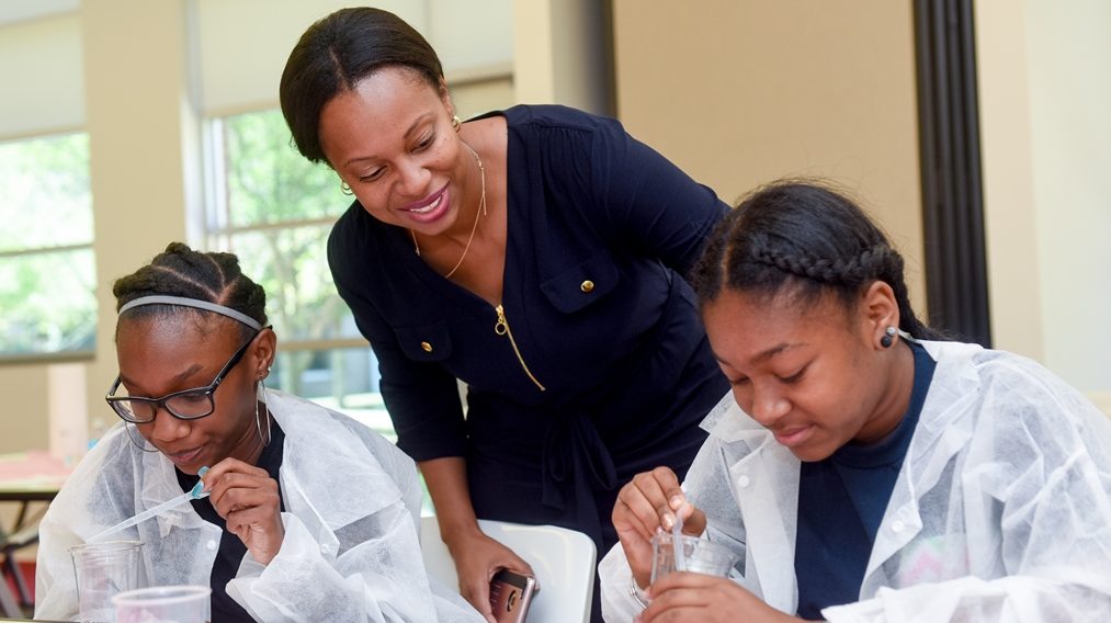 Bailey-Lash with two students