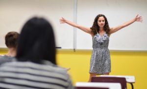 Student standing in front of white board