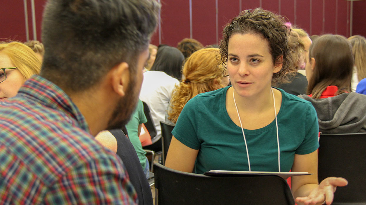 girl and guy talking at workshop