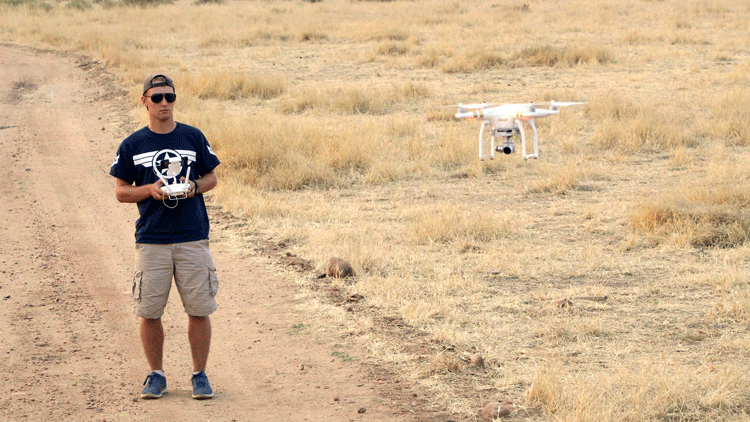 student operating drone