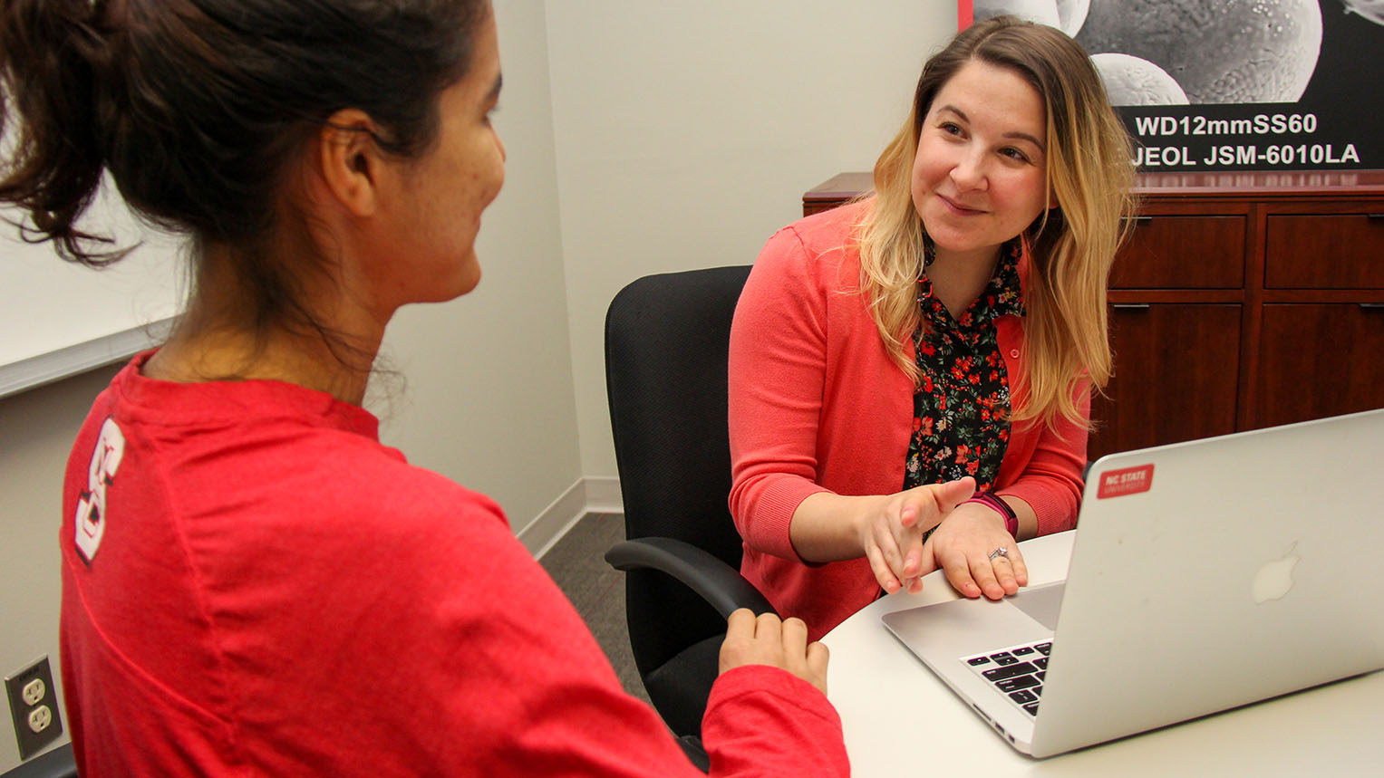 Courtney Hughes meets with a student