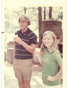 Jessie Rivers at an outdoor event, holding a cup