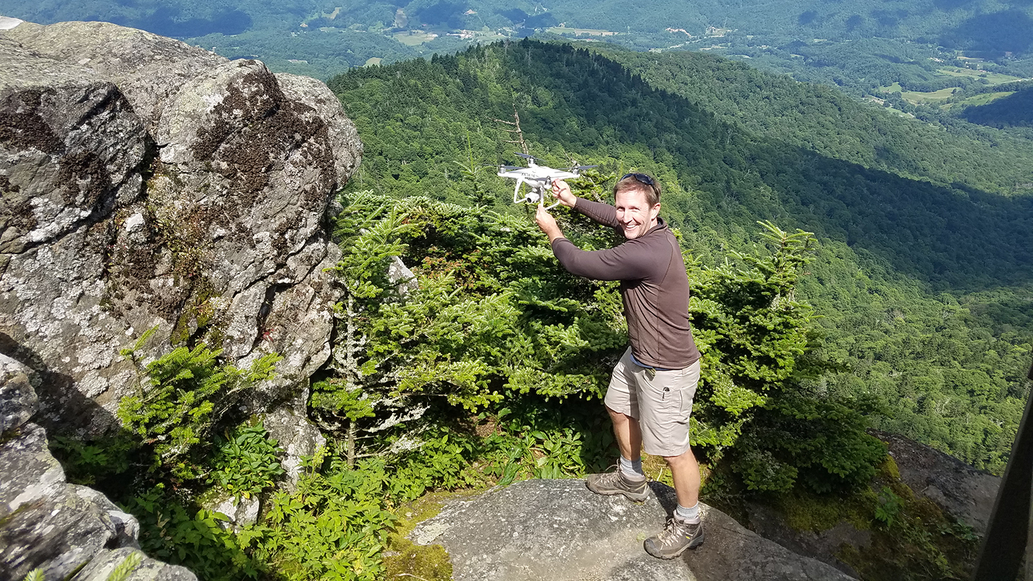 NC State University doctoral researcher Will Reckling prepares to launch a drone on Roan Mountain, NC, to map the area for endangered high-elevation plants.