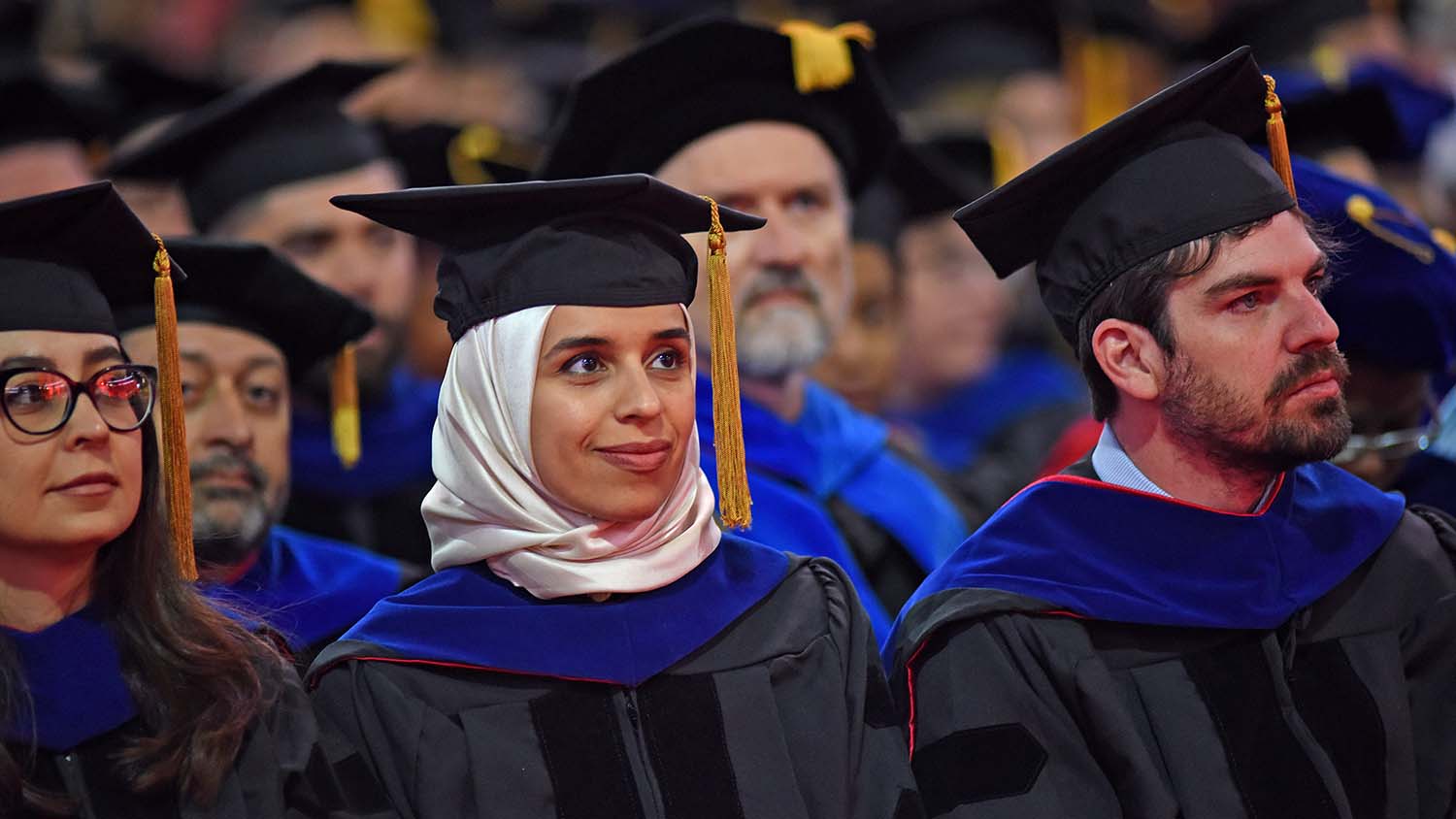 Graduate students listen to the speaker during the Spring 2019 commencement ceremony