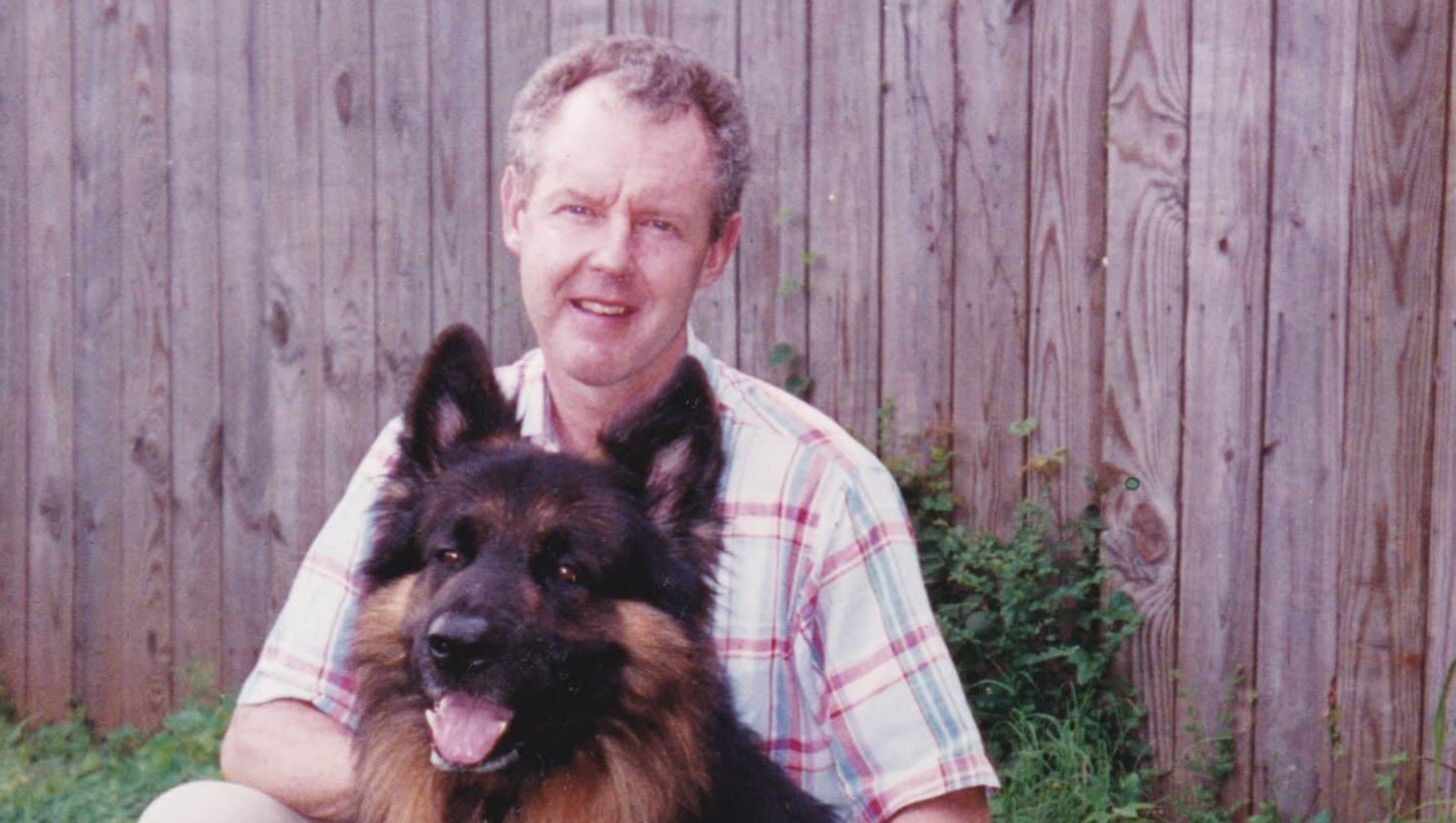 Alumnus John McRary with one of his dogs
