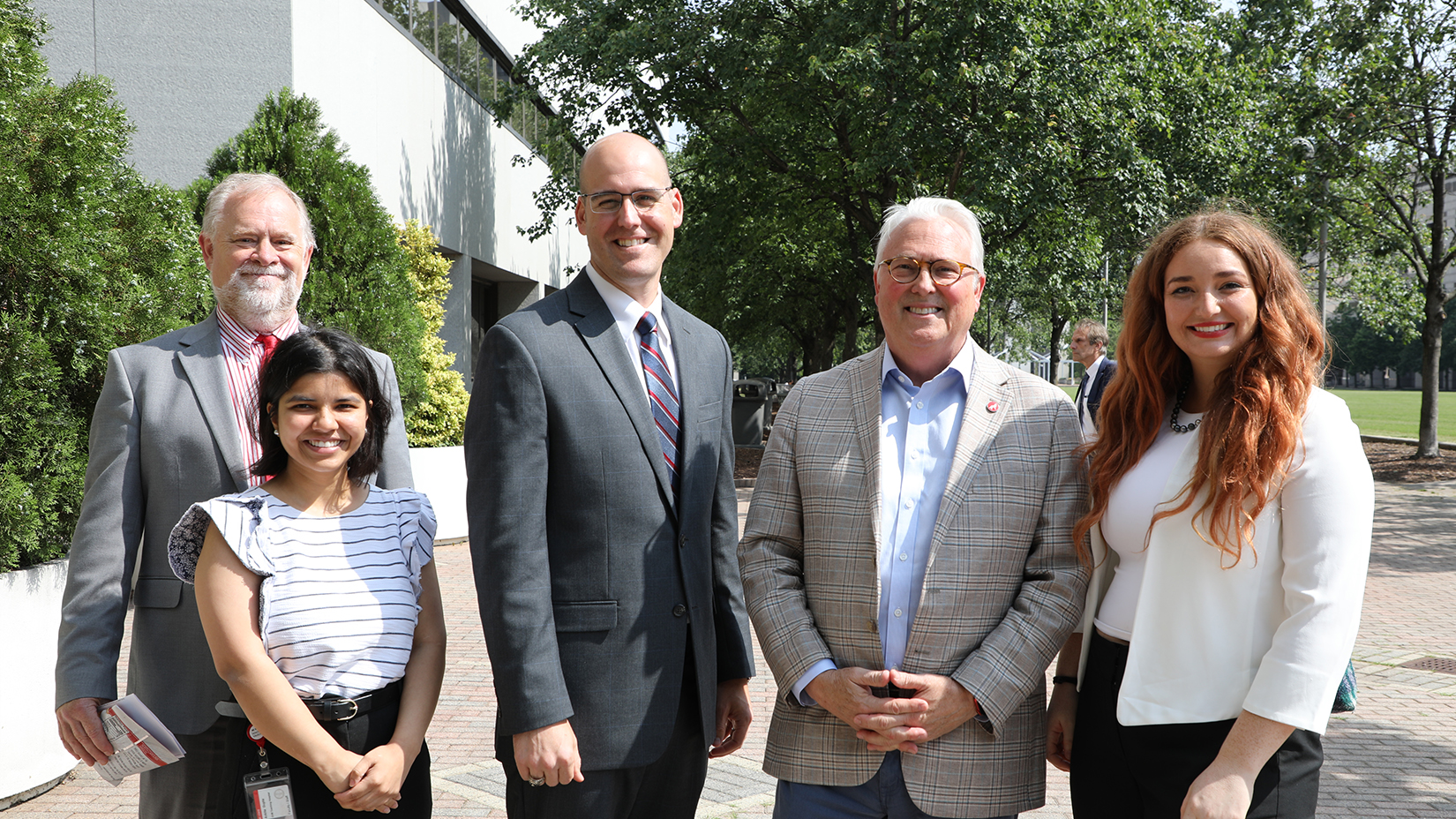 Students pose with Chancellor Woodson during Graduate Education Day