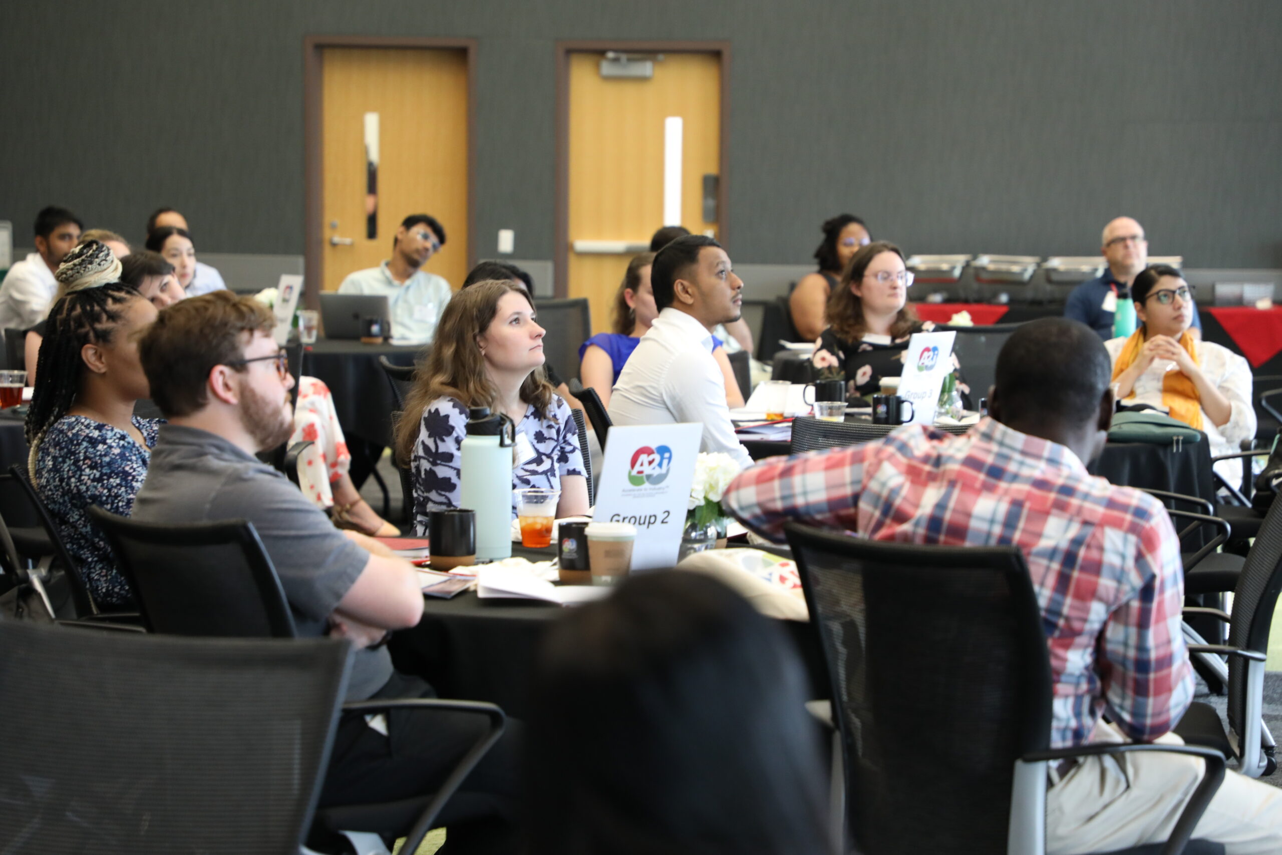 A2i participants listening to a presentation.