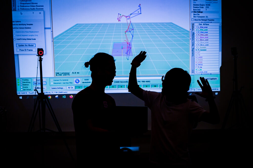 Students interact with robots and imaging software to help better understand the relationships between computers and humans. The Human-Systems engineering lab research aims to improve human safety through human movement measurement and deep learning. Photo by Becky Kirkland.